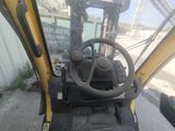a close up of the steering wheel of a construction vehicle