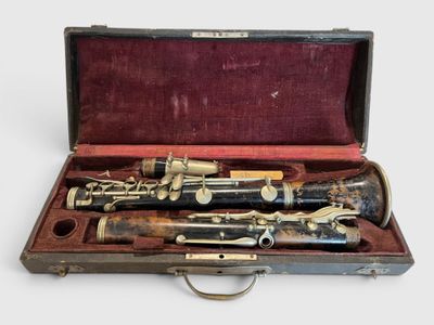 two clarinets in a case on a white surface