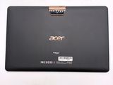 the back view of a laptop with a gold handle on a white surface