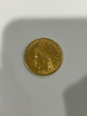 a gold coin sitting on top of a white table