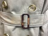 a close up of a belt on a trench coat