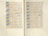 an open book with a blue and yellow writing on it