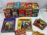 several children ' s books are sitting on a table next to each other