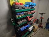 a lot of tools on the shelves in the garage