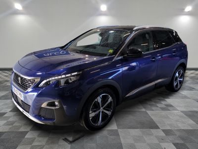 a blue car is parked in a room with a checkered floor