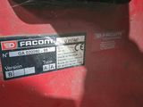 a close up of a red tractor with a sticker on it