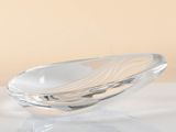 a glass bowl that is sitting on a table