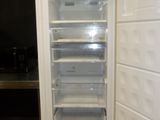 an image of an empty refrigerator in a kitchen