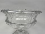 a clear glass vase with a decorative design on it