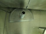 a metal sink with a cup on it in a bathroom