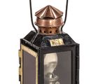 a black and gold lantern with a picture of a man on it