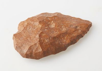 a rock that is sitting on a white surface