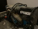 a sander that is sitting on the floor in the room