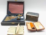 several small items are sitting in a case on a white surface