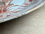 a plate with flowers on it sitting on a table