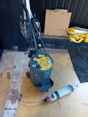 une machine posée par terre à côté d'un Syssor