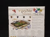 the harry potter board game is in its box on a black surface