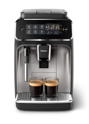 une machine à café devant laquelle se trouvent deux tasses de café