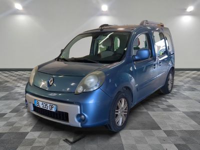 a small blue car that is parked on a checkered floor