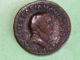 a close up of a coin on a green surface