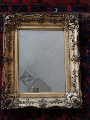a picture of a mirror that is on the floor