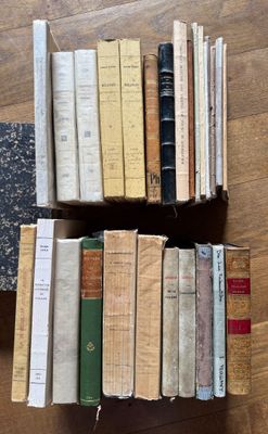 a lot of books that are sitting on a table