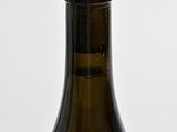 a bottle of beer sitting on a wooden table