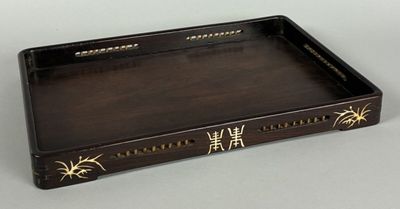 an image of a wooden tray with writing on it on a table
