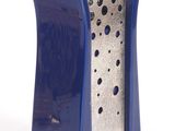 a blue vase that has holes in it on a white surface