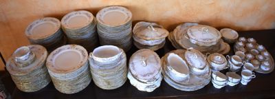 many different types of plates and bowls on a table