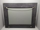 a picture of a mirror with a rope hanging from it