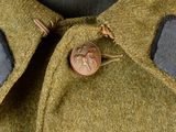 a close up of a jacket with a button on it