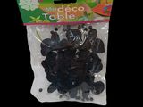 a bag of buttons that are on a black background