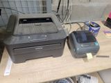 a printer and a scanner sitting on a table