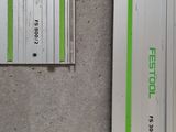 two green and white batteries sitting next to each other on a cement floor