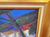 a picture of a painting of a dragonfly in a picture frame