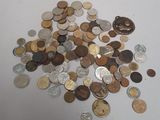 a pile of coins sitting on a white table