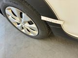 a close up of a car tire with a sticker on it