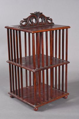 an antique wooden shelf with three shelves on each side and a shelf on the other side