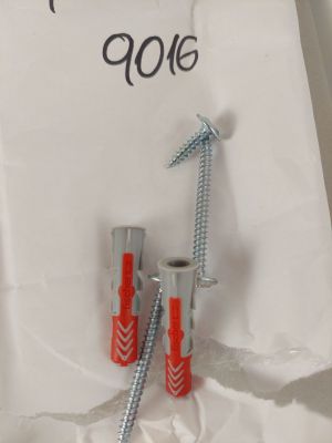 deux vis et un boulon sur un bout de papier