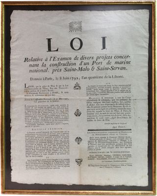 an old document with a picture of a cross on it in a gold frame