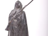 statue of a man in a cloak holding a staff