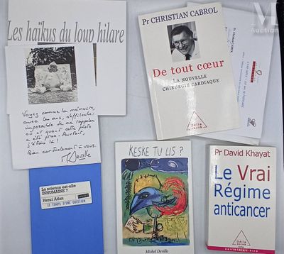 many books on the table with a lot of writing on them