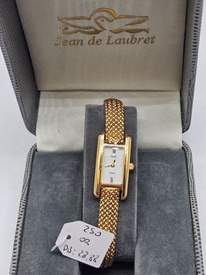 an image of a watch in a box with a price tag on it