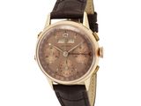 an image of a watch with a brown dial and brown leather strap