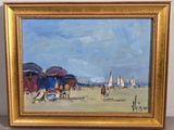 une peinture à l'huile représentant une scène de plage, dans un cadre doré