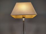 a lamp that is sitting on a table in a room