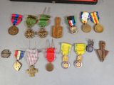 many medals and medals hanging on the wall