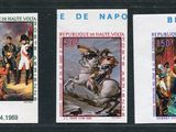 three stamps with a picture of a man on a horse and a man on a horse