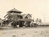 a black and white photo of an old house